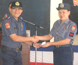 Senior Police Officer I Bolivar receives from Police Superintendent Demiar her cash prize as winner in the Police Regional Office 6 Whiz Quiz. 