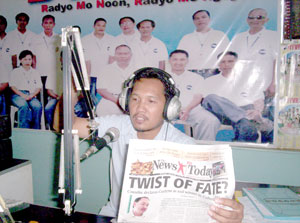 RMN DYVR's hard-hitting commentator Martin Roxas holds a copy of The News Today