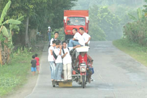 The tricycle is the most common mode of transportation for students.