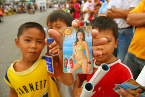 Young boys show off the freebies—calendars and liquors.