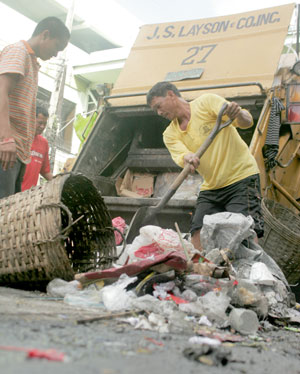 Garbage collectors had their day full gathering all the mess left by the three-day revelry of the 2009 Dinagyang Festival in the major streets of the city yesterday.