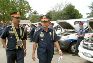 Philippine National Police chief, Director General Jesus Versoza (left) and Police Regional Office Six director, Chief Supt. Isagani Cuevas (right) inspect the 39 new patrol cars and motorcycles distributed to he various police stations in Western Visayas.
