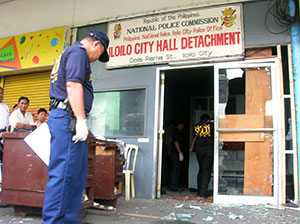 Scene of the Crime Operatives (SOCO) check on the damage caused by the accidental grenade explosion inside the Iloilo City Hall Detachment yesterday morning.