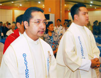 Fr. Rolly Briones, over-all director (middle) with other priests.