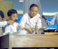 Mrs. Pauline Banusing with son Justin during their cooking demo of Pizzetas de Molo.