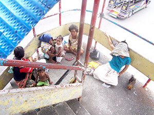 This group of Aetas makes the multi-million skywalk at the junction of Iznart and Delgado streets in Iloilo City as their home.
