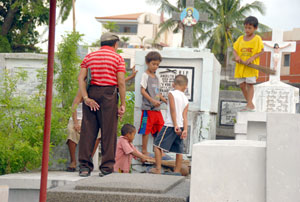 Children have started cleaning the tombs at the Tanza cemetery, Iloilo City’s largest public graveyard
