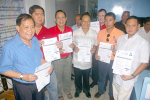 Lakas-Kampi-CMD bets show their certificates of candidacy (COC), from left, Rep. Arthur Defensor Sr. (for governor)