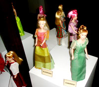 An exhibit of dolls' dresses.