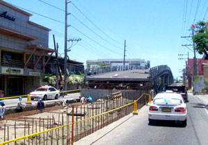 Workers speed up the construction of Iloilo City's second flyover at the junction of Gen. Luna and Jalandoni Streets.