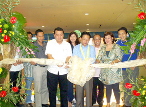 OPENING. Provincial Administrator Raul Banias, Executive Assistant to the Mayor Francis Cruz, and Anilao Mayor Matet Debuque lead the ribbon cutting rites