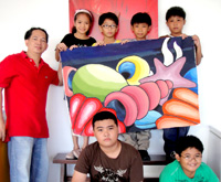 Students pose with Sir Mark and their group painting. This painting was bought during the auction by Mrs. Cabelara of San Dionisio Iloilo.