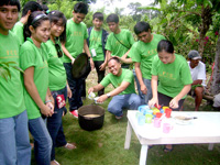 NSTP students happily preparing the food.
