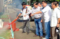 Mayor Jed Patrick Mabilog and Chinese Filipino Business Club Director Richard Alviar observe a fogging operation at the Iloilo City Central Elementary School, with businessmen Charlie Ho, Emilio Cua Locsin, Francis Sio and Oscar Chua. 