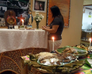 An employee says a prayer in a nook set up by the Capiz Tourism Office as part of the “Pangalagkalag Exhibit”