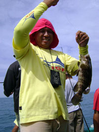 Birthday boy Mon 'Yolak' Vera Cruz with his catch.
