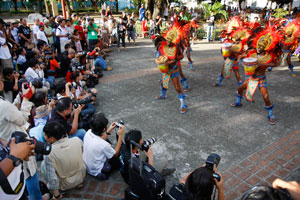 A group of over 90 photographers from Indonesia, Malaysia, Singapore, Vietnam and the Philippines who are now traveling to Cebu, Bacolod and now Iloilo take pictures of performing Dinagyang tribes Tuesday at Plaza Libertad.