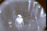 The two robbers entering Mr. Mejicas’s office as captured on CCTV camera.